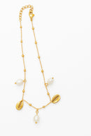 Pulseira de pé conchas e pérolas