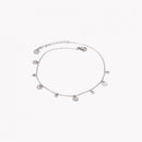 Pulseira de pé aço com pendentes redondos